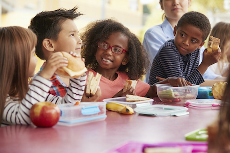 Young children eating tooth-friendly lunch