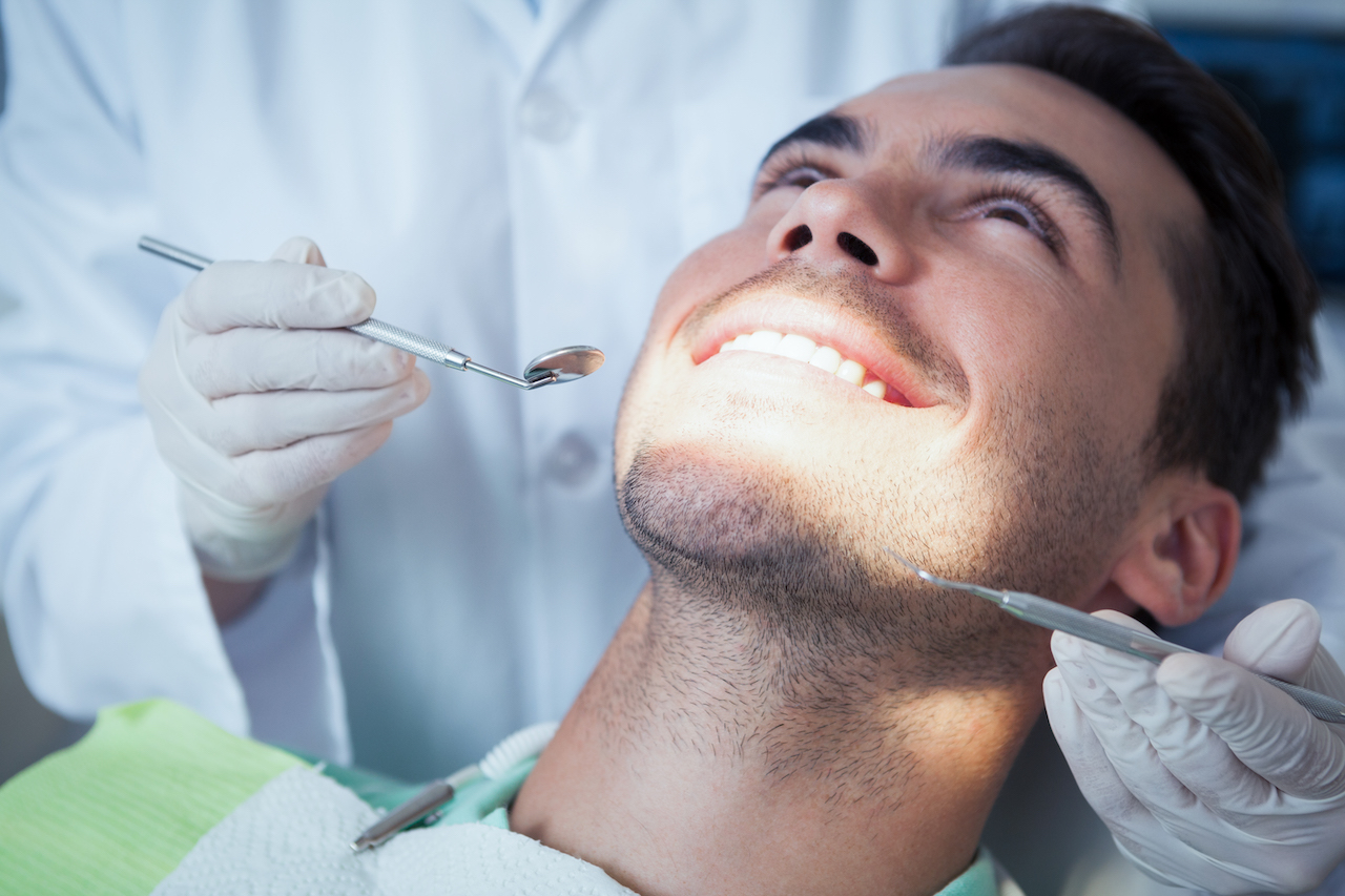 Man undergoing regular dental checkup to keep teeth healthy.